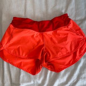Lulu lemon coral and red 2.5 inch shorts size 6